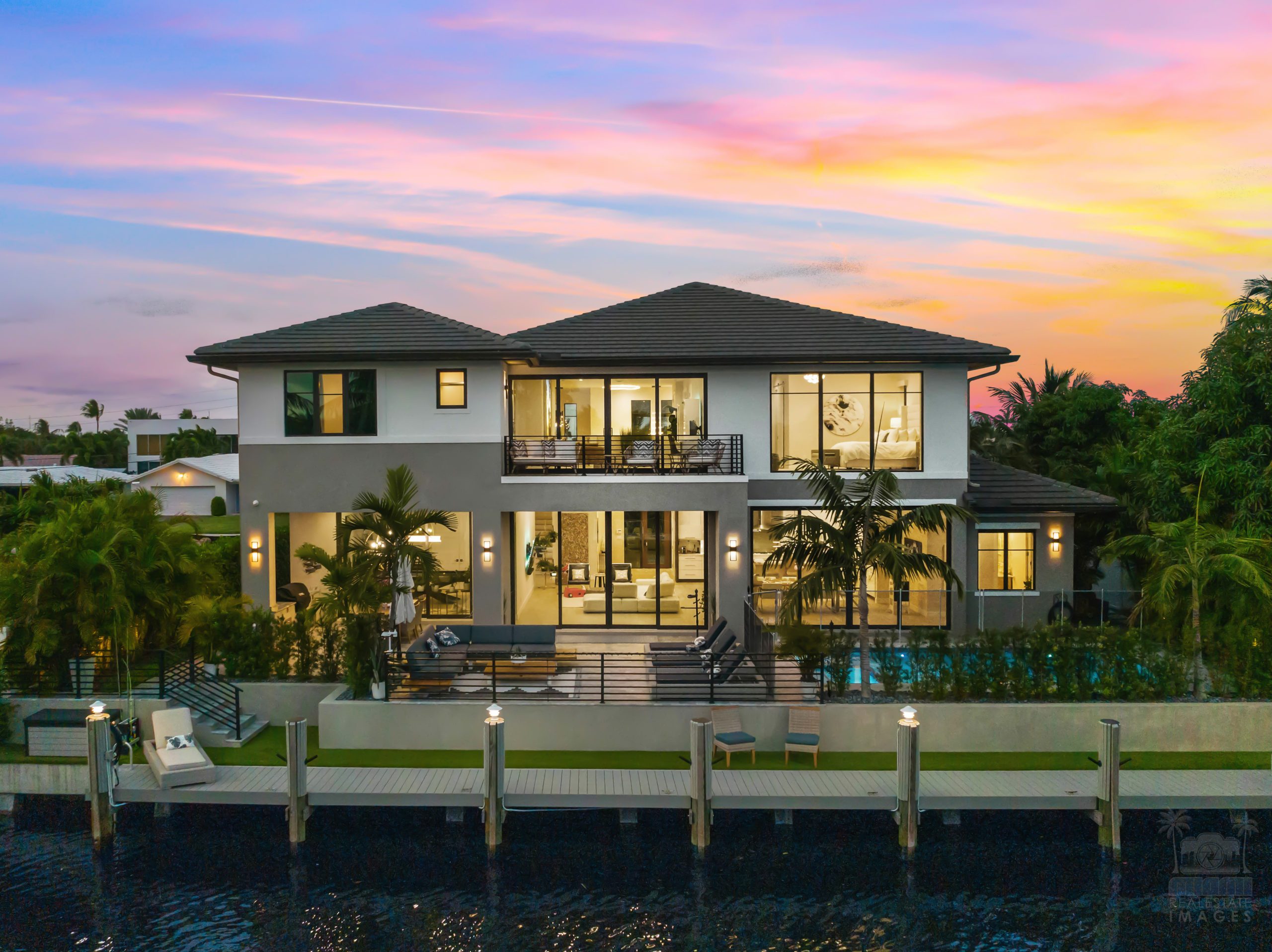 MREI 2023 portfolio -1 Premium real estate twilight photography and aerial drone video showcase of a luxury waterfront home with a private dock in Keystone Point.