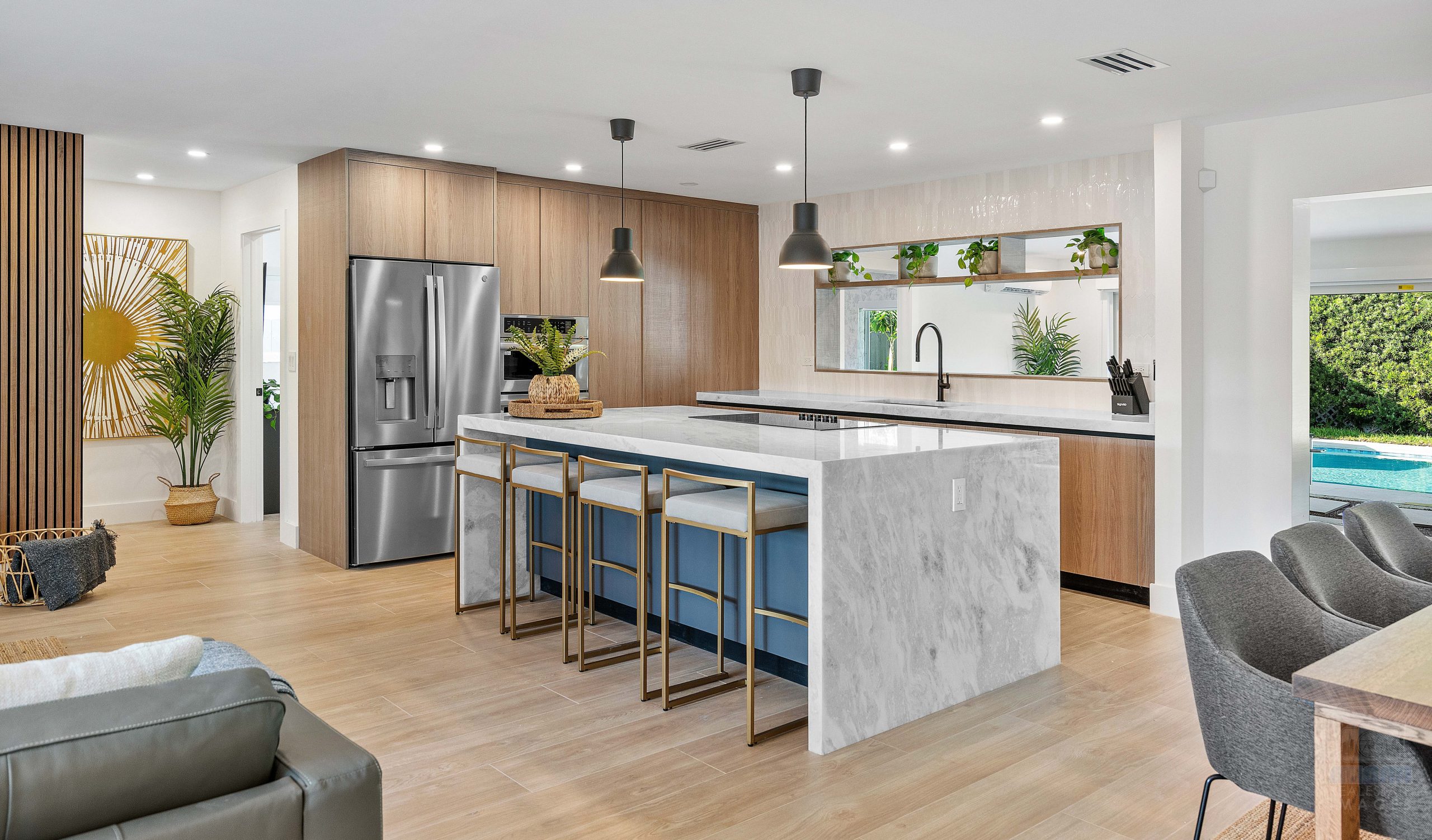 MREI 2023 portfolio -2 Modern custom kitchen interior design photography in a luxury Morningside home, created by Miami Real Estate Images.